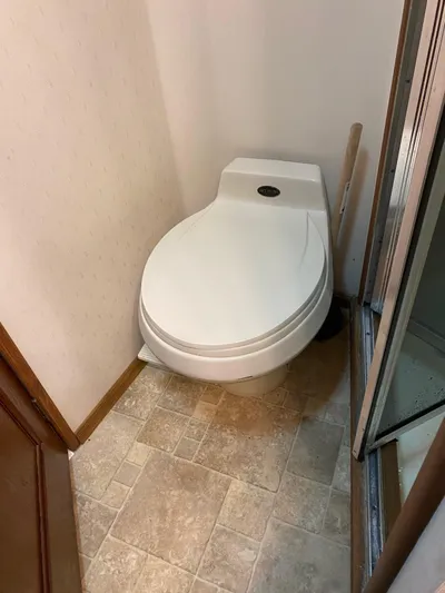 Kraken Yacht Photos Pics 1990 Viking 38 Convertible boat bathroom with compact toilet.