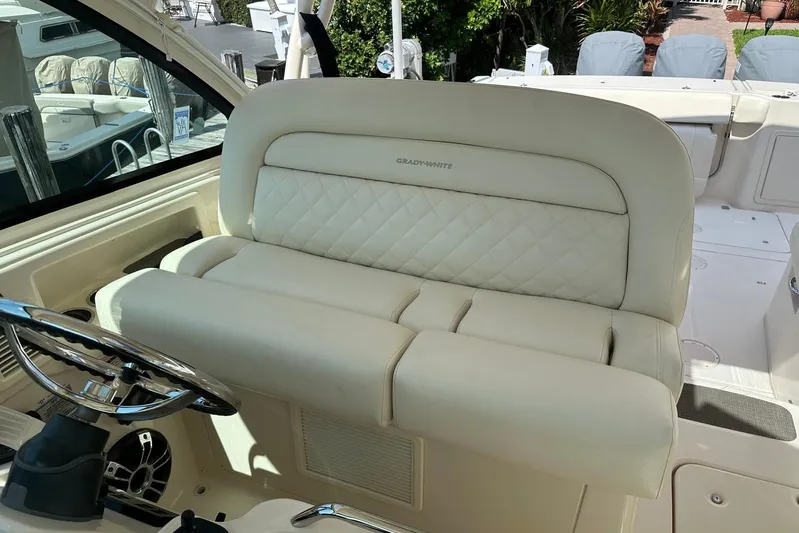 V5 Yacht Photos Pics 2019 Grady-White Freedom 375 boat interior with luxurious seating and steering wheel.