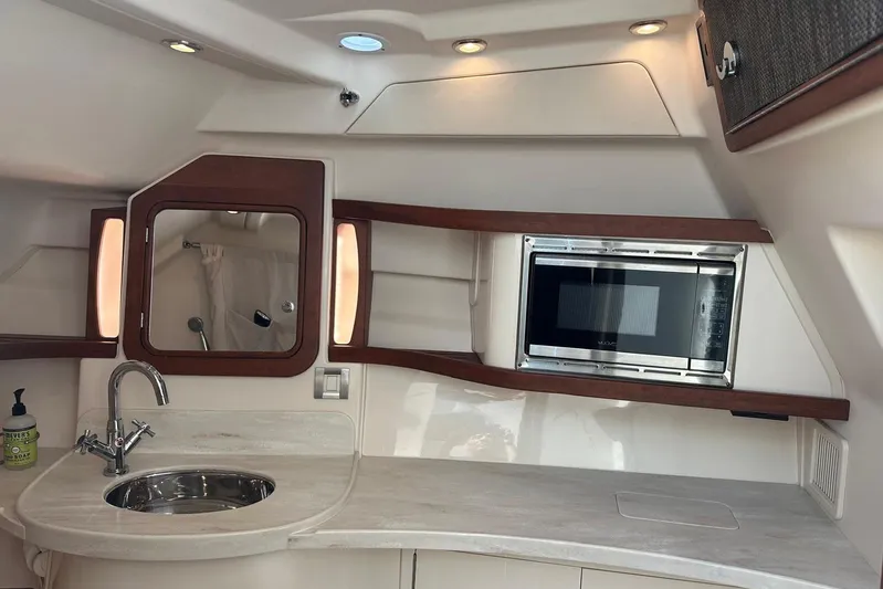 V5 Yacht Photos Pics 2019 Grady-White Freedom 375 boat interior with sink and microwave.