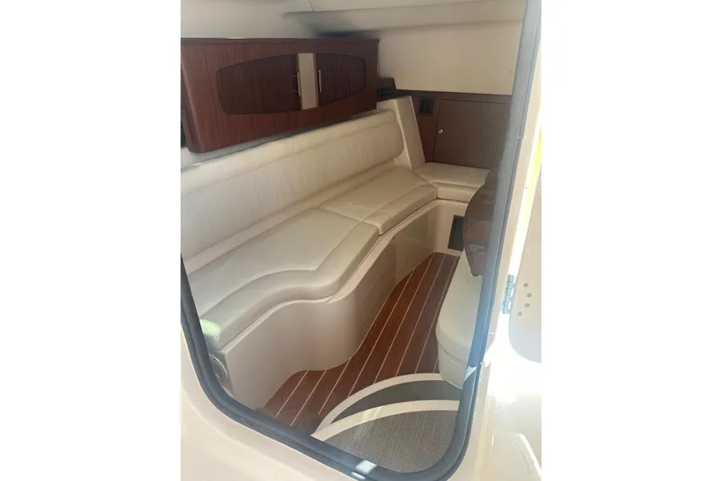 V5 Yacht Photos Pics 2019 Grady-White Freedom 375 cabin interior with beige seating and wood accents.