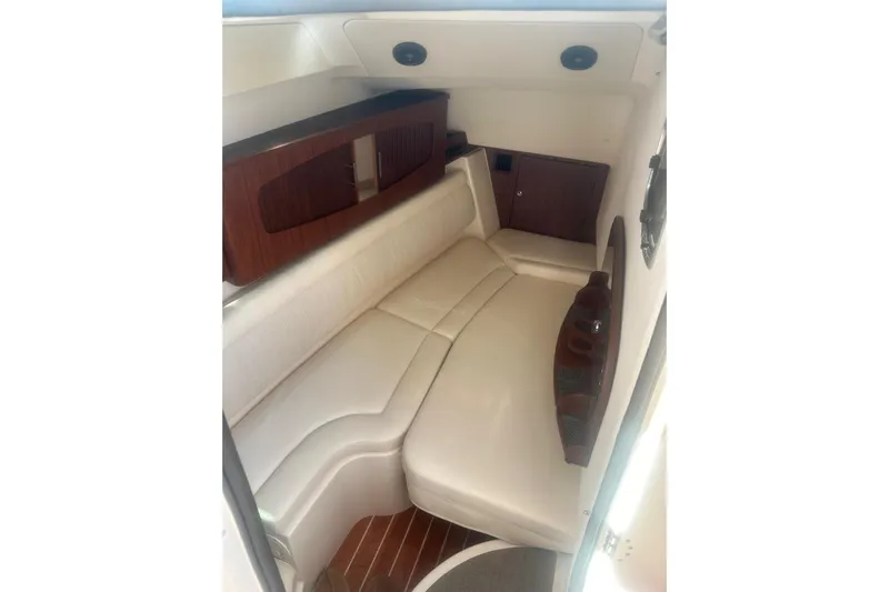 V5 Yacht Photos Pics 2019 Grady-White Freedom 375 cabin interior with white seating and wooden accents.