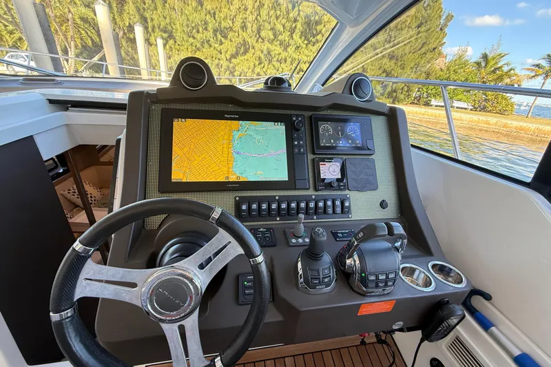  Yacht Photos Pics Cockpit of 2018 Azimut Atlantis 43 yacht with navigation controls and display.