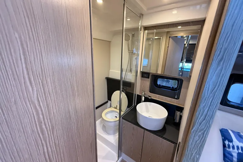  Yacht Photos Pics Luxurious bathroom interior of 2018 Azimut Atlantis 43 yacht with modern fixtures.