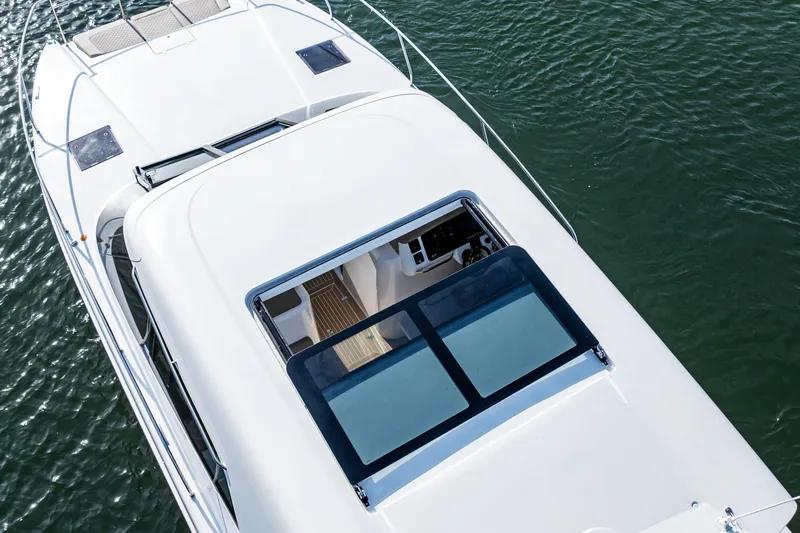  Yacht Photos Pics Top view of 2025 Makai M37 yacht on water, showcasing sleek design and spacious deck.