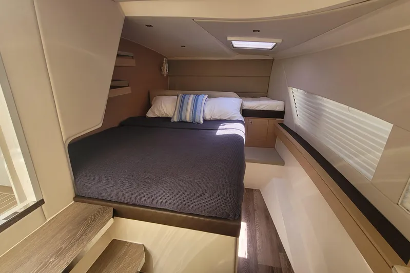  Yacht Photos Pics Luxurious cabin interior of 2025 Makai M37 yacht with cozy bed and modern design.