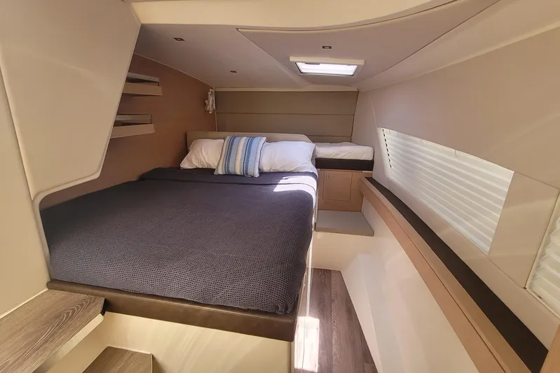  Yacht Photos Pics Luxurious cabin interior of 2025 Makai M37 yacht with cozy bedding and modern design.