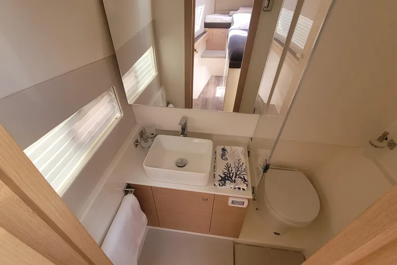  Yacht Photos Pics Modern bathroom interior in 2025 Makai M37 yacht, featuring sleek sink and toilet design.