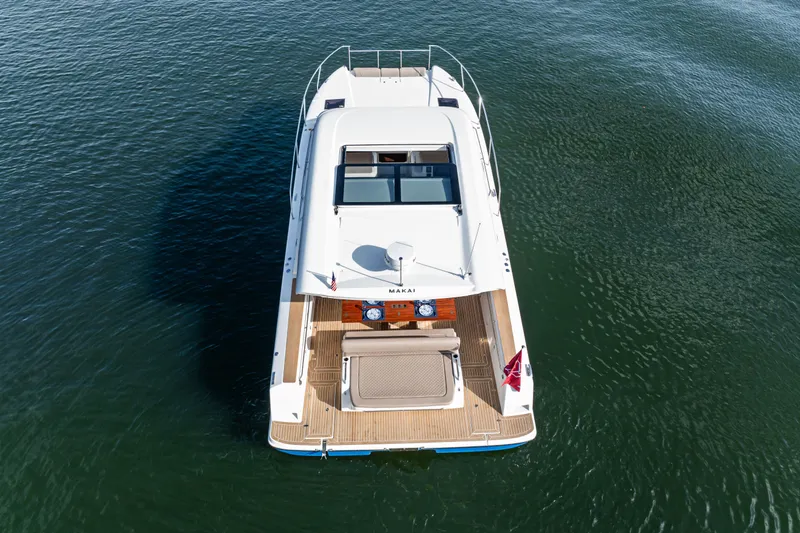  Yacht Photos Pics Aerial view of 2025 Makai M37 yacht on calm water.