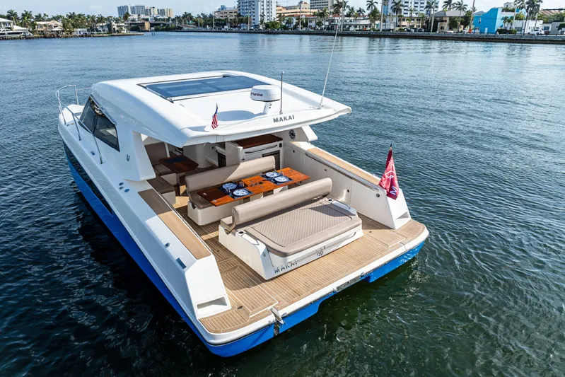  Yacht Photos Pics 2025 Makai M37 yacht on water, featuring spacious deck and modern design.