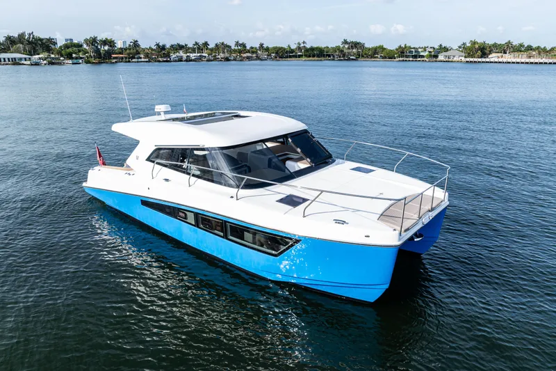  Yacht Photos Pics 2025 Makai M37 yacht cruising on calm waters, showcasing sleek design and modern features.