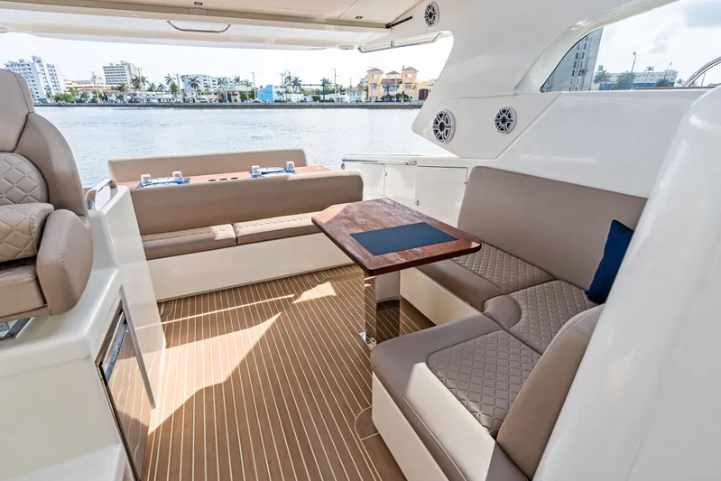  Yacht Photos Pics Luxurious interior of 2025 Makai M37 yacht with elegant seating and waterfront view.