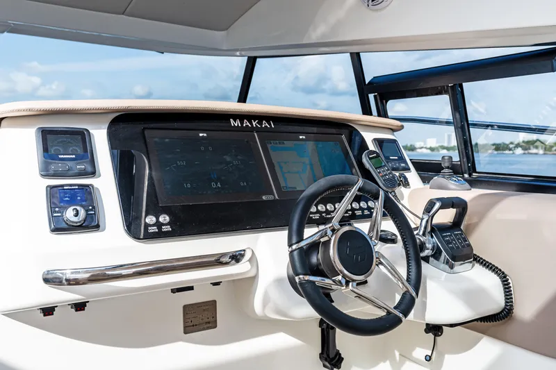  Yacht Photos Pics Helm of 2025 Makai M37 boat with advanced navigation controls and steering wheel.