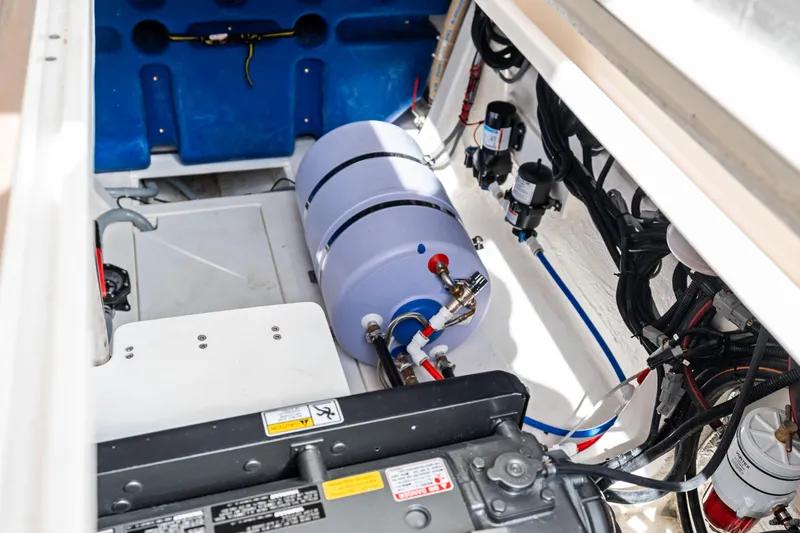  Yacht Photos Pics Engine compartment of 2025 Makai M37, showcasing mechanical components and wiring.