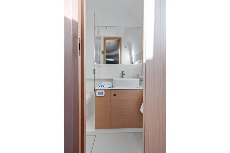  Yacht Photos Pics Modern bathroom interior in 2025 Makai M37, featuring sleek design and wooden cabinetry.