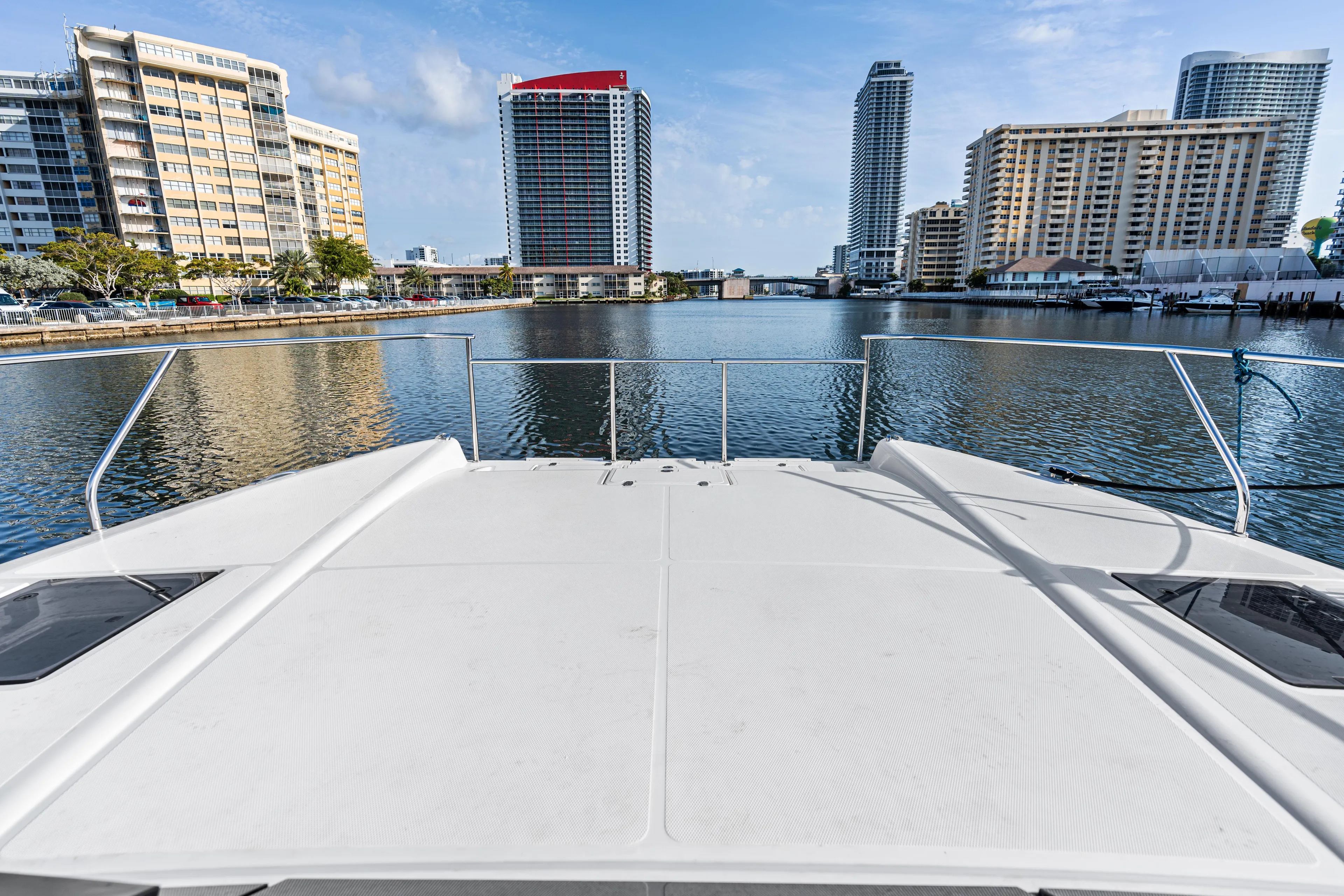  Yacht Photos Pics Bow view from Makai M37 yacht, 2025, overlooking urban waterfront skyline.