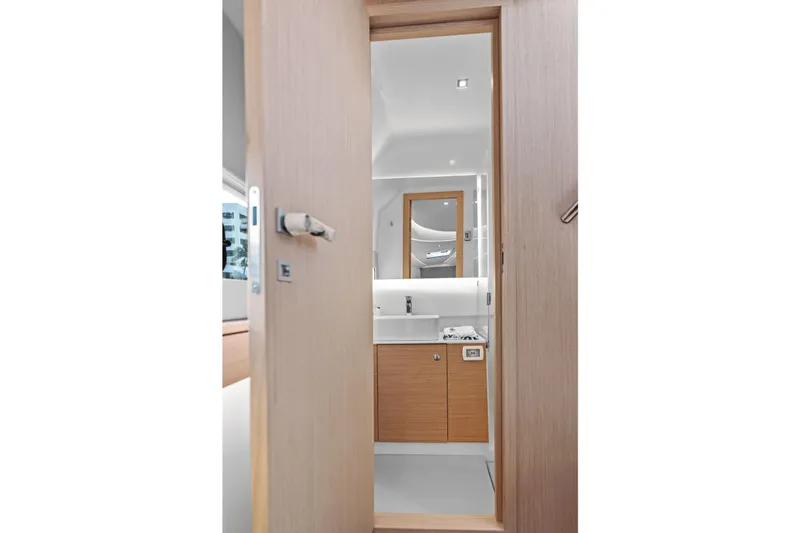  Yacht Photos Pics Modern bathroom interior on Makai M37 yacht, 2025 model, featuring sleek wood and white design.
