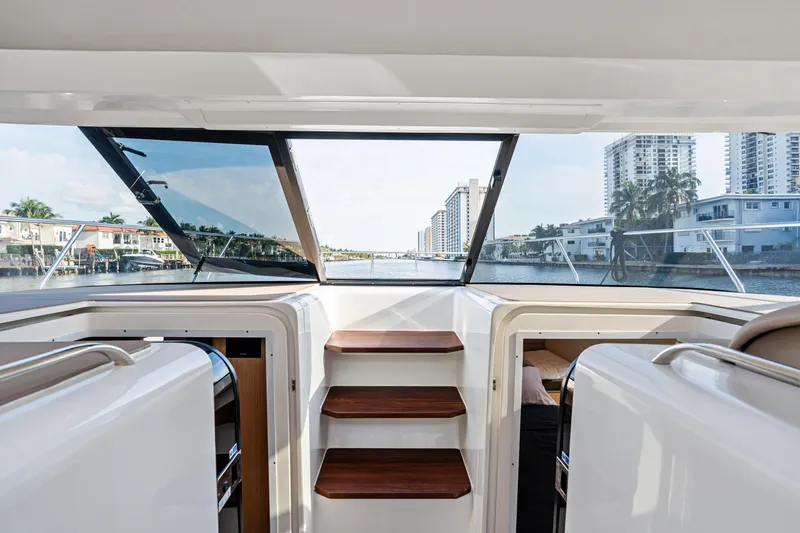  Yacht Photos Pics Interior view of 2025 Makai M37 yacht with cityscape through windows.