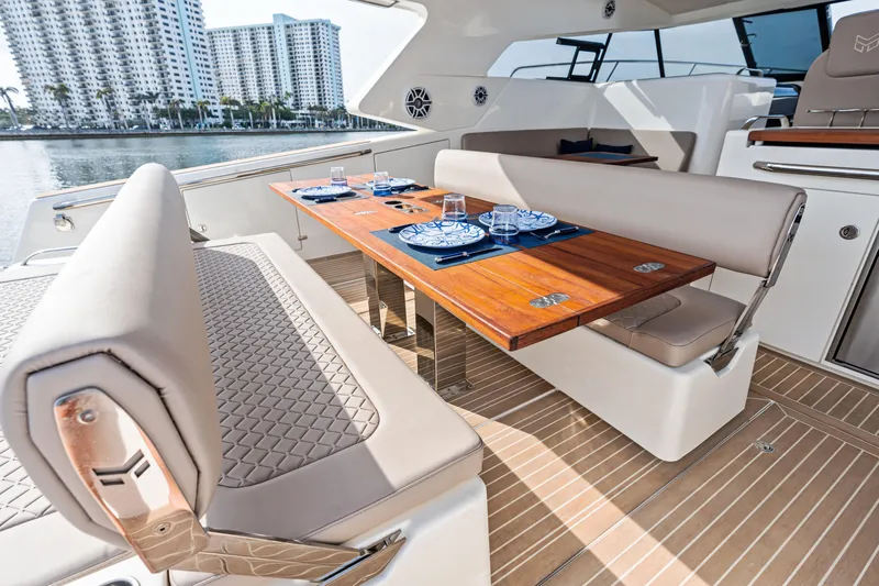 Yacht Photos Pics Luxurious 2025 Makai M37 yacht interior with elegant dining area and waterfront view.