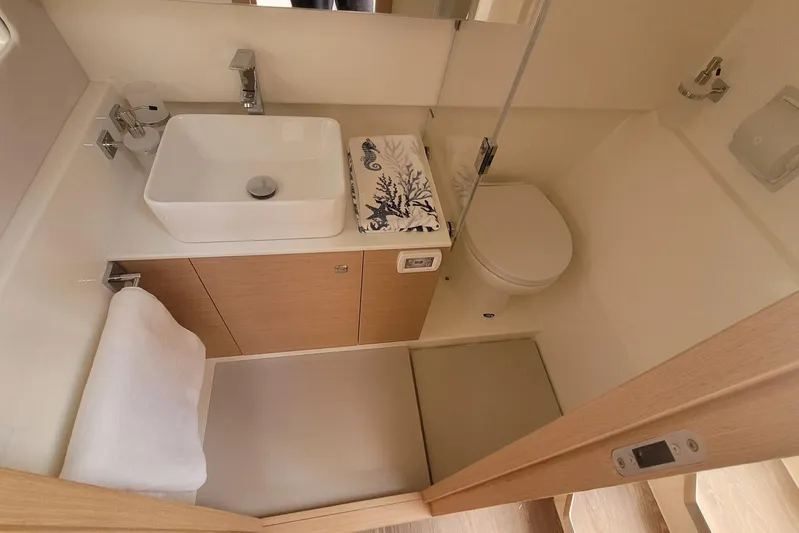  Yacht Photos Pics Modern bathroom in 2025 Makai M37 yacht with sleek sink and compact design.