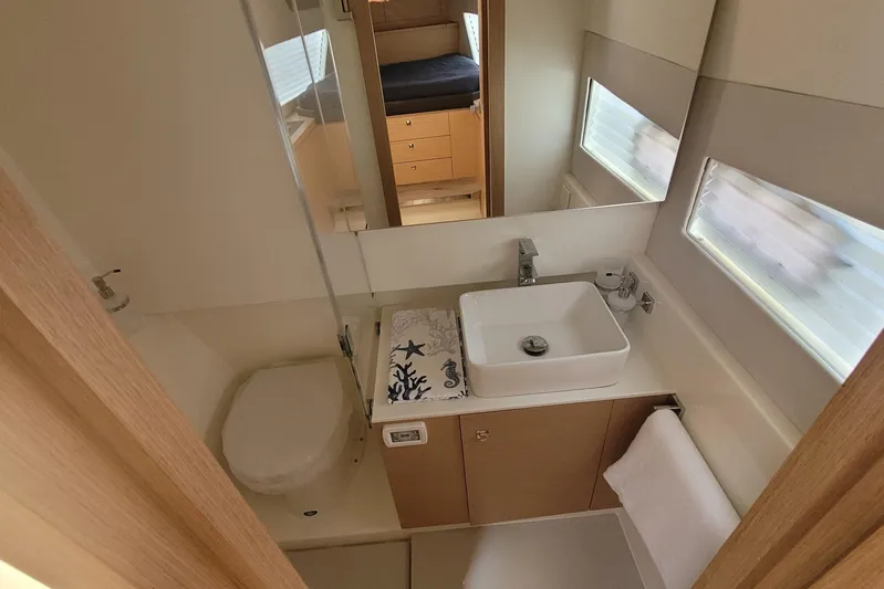  Yacht Photos Pics Modern bathroom in 2025 Makai M37 yacht with sleek sink and compact design.