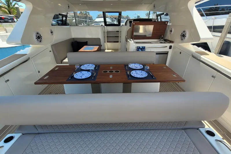  Yacht Photos Pics Luxurious 2025 Makai M37 yacht interior with elegant dining setup and modern amenities.