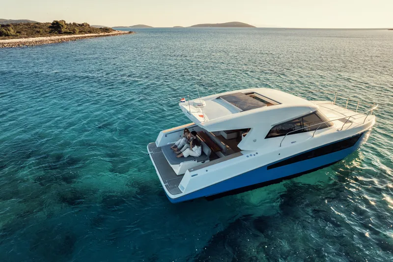  Yacht Photos Pics Luxury Makai M37 yacht cruising on clear blue waters, 2025 model.