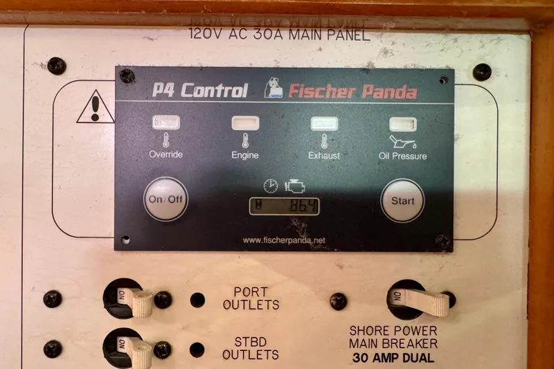 Ostrich Yacht Photos Pics Fischer Panda P4 Control panel on 2004 Catalina 42 MkII yacht, showing power and engine controls.