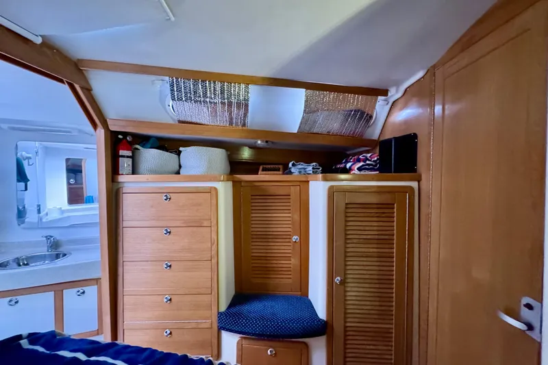 Ostrich Yacht Photos Pics Interior of 2004 Catalina 42 MkII sailboat with wooden cabinets and cozy seating.