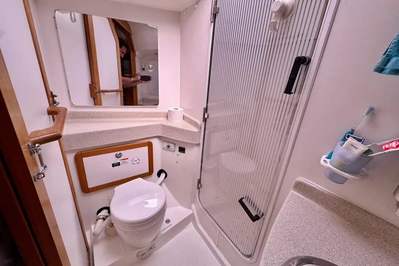 Ostrich Yacht Photos Pics Bathroom interior of a 2004 Catalina 42 MkII sailboat, featuring a toilet and shower.