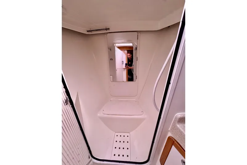 Ostrich Yacht Photos Pics Interior of 2004 Catalina 42 MkII sailboat, featuring a compact shower area.