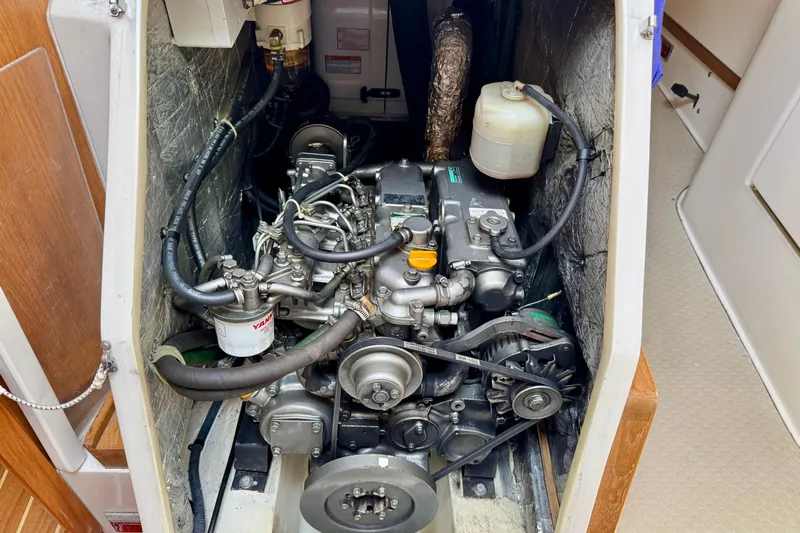 Ostrich Yacht Photos Pics Engine compartment of a 2004 Catalina 42 MkII sailboat, showcasing detailed mechanical components.