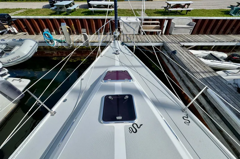 Ostrich Yacht Photos Pics Deck view of a 2004 Catalina 42 MkII sailboat docked at a marina.