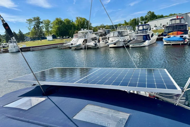 Ostrich Yacht Photos Pics Solar panel on 2004 Catalina 42 MkII yacht docked at marina with other boats.