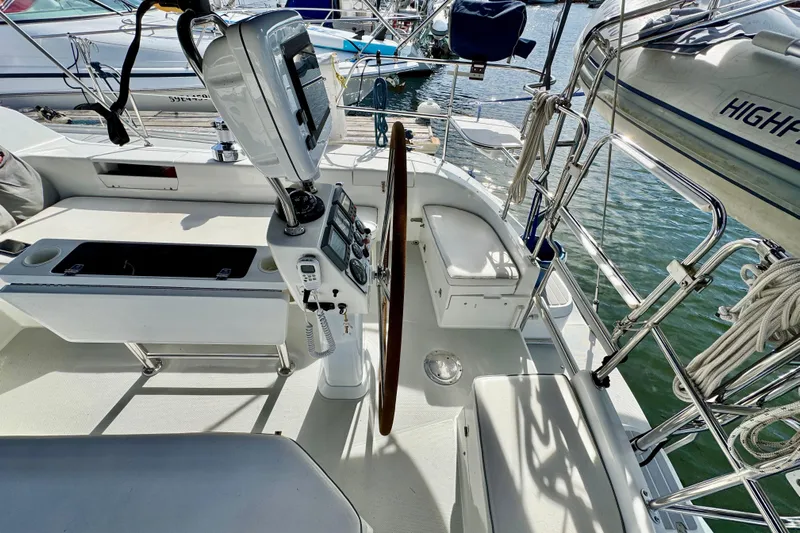 Ostrich Yacht Photos Pics Cockpit of 2004 Catalina 42 MkII sailboat with steering wheel and navigation equipment.