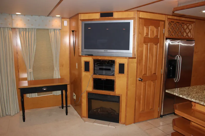  Yacht Photos Pics Interior of 2007 Legacy Yachts Majestic with TV, fireplace, and modern kitchen.