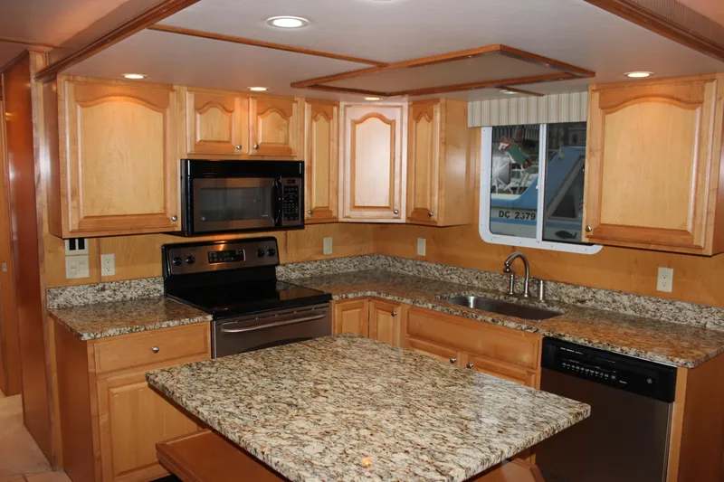  Yacht Photos Pics Luxurious 2007 Legacy Yachts Majestic kitchen with granite countertops and modern appliances.