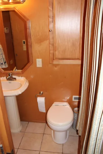  Yacht Photos Pics 2007 Legacy Yachts Majestic bathroom with wooden cabinetry and modern fixtures.