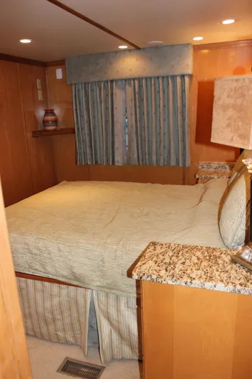  Yacht Photos Pics Luxurious 2007 Legacy Yachts Majestic bedroom with elegant decor and granite-topped furniture.