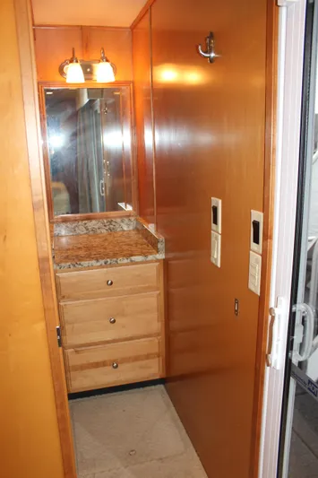  Yacht Photos Pics 2007 Legacy Yachts Majestic bathroom with wooden cabinetry and granite countertop.