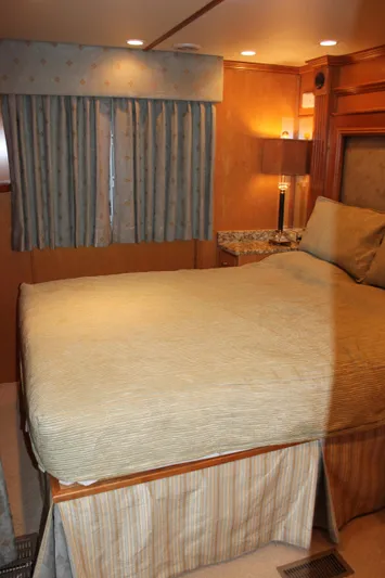  Yacht Photos Pics Luxurious bedroom interior of 2007 Legacy Yachts Majestic with elegant bedding and ambient lighting.