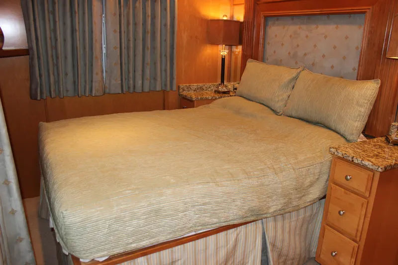  Yacht Photos Pics Luxurious bedroom interior of 2007 Legacy Yachts Majestic with cozy bedding and elegant decor.