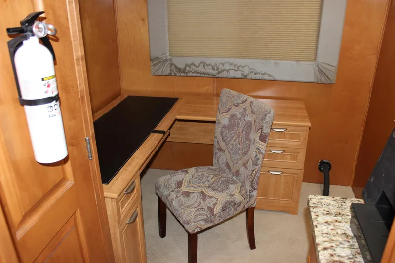 Yacht Photos Pics Office space in 2007 Legacy Yachts Majestic with desk, chair, and fire extinguisher.