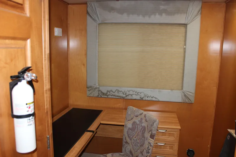  Yacht Photos Pics Interior of 2007 Legacy Yachts Majestic with desk, chair, and window shade.