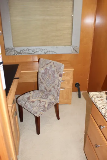  Yacht Photos Pics Interior of 2007 Legacy Yachts Majestic with elegant chair and wooden cabinetry.