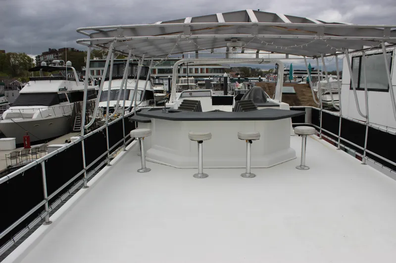  Yacht Photos Pics 2007 Legacy Yachts Majestic with spacious deck and bar stools, docked at marina.