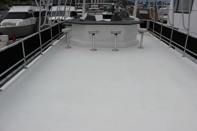  Yacht Photos Pics Upper deck of 2007 Legacy Yachts Majestic with bar and stools.