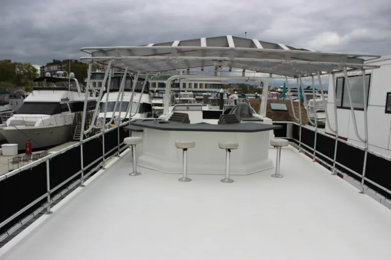  Yacht Photos Pics Luxurious 2007 Legacy Yachts Majestic with spacious deck and bar area, docked at marina.