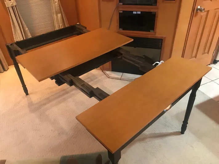  Yacht Photos Pics Expandable wooden table in a 2007 Legacy Yachts Majestic interior.