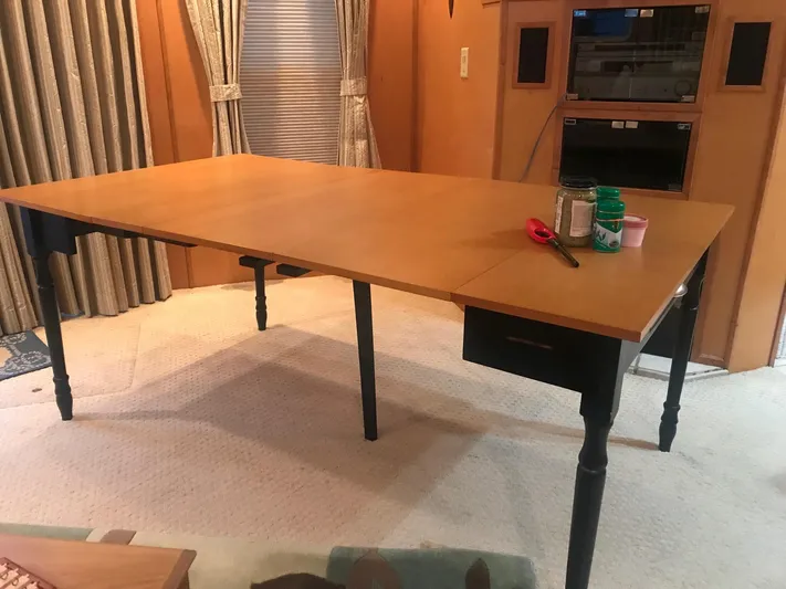  Yacht Photos Pics Spacious interior of 2007 Legacy Yachts Majestic with a large wooden table.