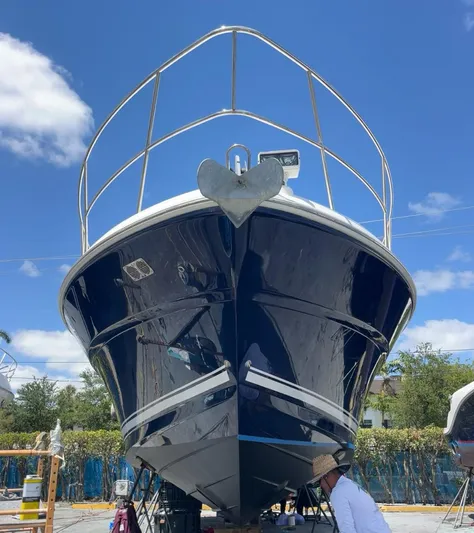 Desert Dream Yacht Photos Pics 2007 Sea Ray 40 Sundancer yacht on land, blue hull, clear sky background.